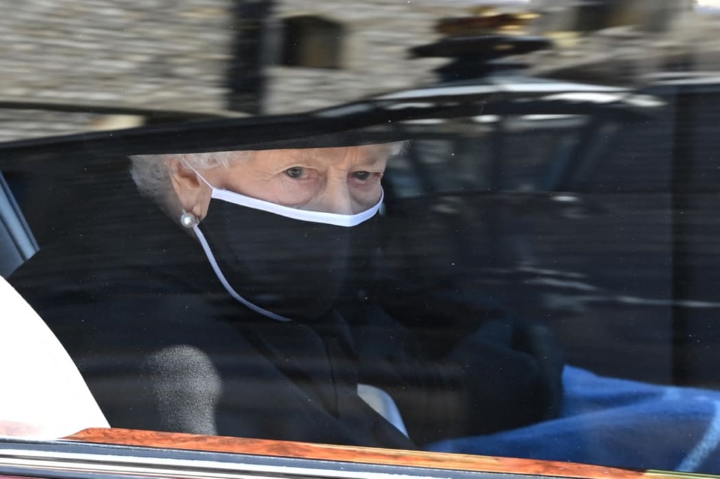 Britain's Queen Elizabeth II arrives in the Royal Bentley at the funeral for her husband, Britain's Prince Philip, Duke of Edinburgh to St George's Chapel in Windsor Castle in Windsor, west of London, on April 17, 2021.