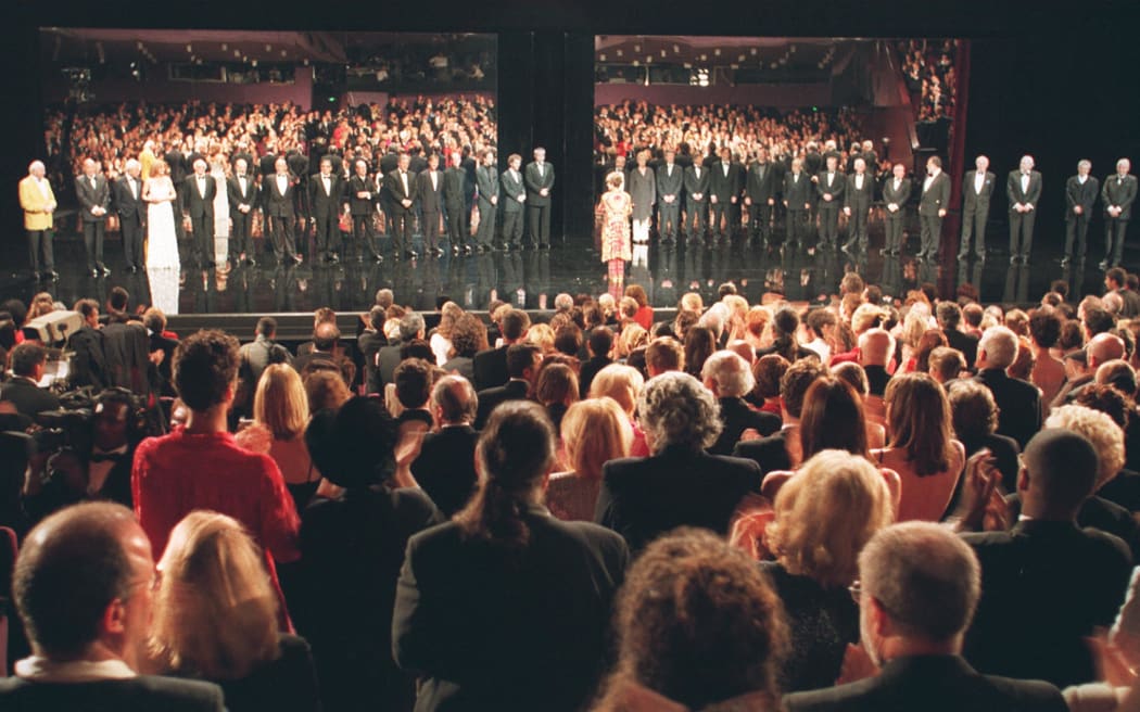 Standing ovation of the audience in front of former Golden Palms laureates on the stage of the festivals Palace 11 May during the Palm of the Golden Palms ceremony. The Cannes film festival was celebrating its 50th anniversary on Sunday.