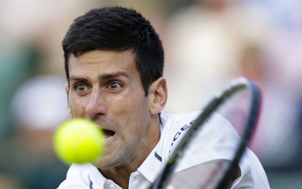 Top seed Novak Djokovic in action against 14th seed Kevin Anderson at Wimbledon, 2015.