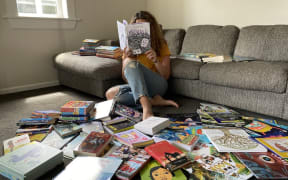 Sonya Wilson with some of previously donated books