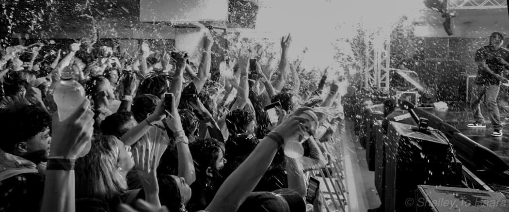 Lil yachty pours water over the crowd at Ellerslie Event Centre