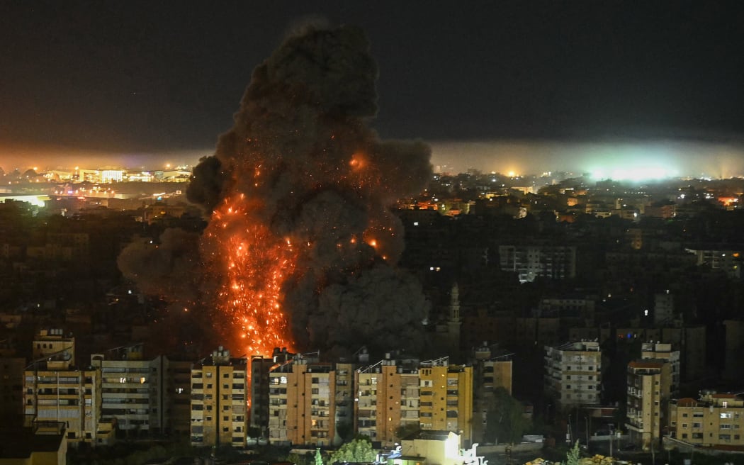 A fireball rises from the site of an Israeli airstrike that targeted an area in Beirut’s southern suburbs.