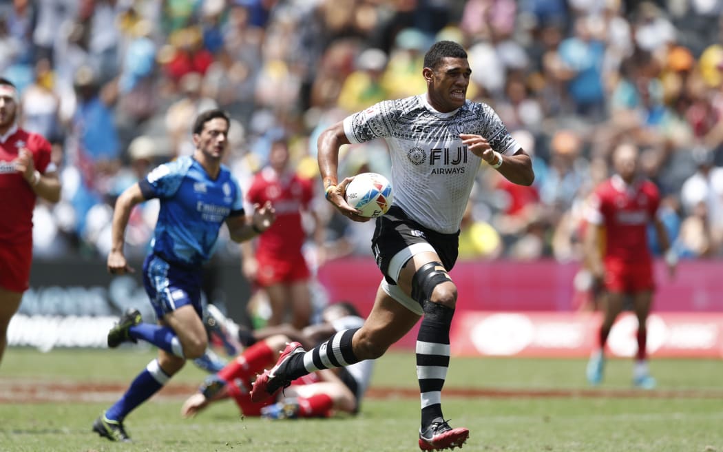 Fiji captain Meli Derenalagi races away from the Wales defence.