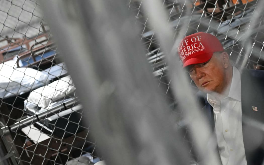US President President Donald Trump visits a migrant detention center, dubbed "Alligator Alcatraz," located at the site of the Dade-Collier Training and Transition Airport in Ochopee, Florida on July 1, 2025. President Trump is visiting a migrant detention center in a reptile-infested Florida swamp dubbed "Alligator Alcatraz," a 5,000-bed facility -- located at an abandoned airfield in the Everglades wetlands -- part of his expansion of deportations of undocumented migrants, his spokeswoman said. (Photo by ANDREW CABALLERO-REYNOLDS / AFP)