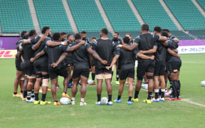 Fiji huddle together during their captain's run in Oita.