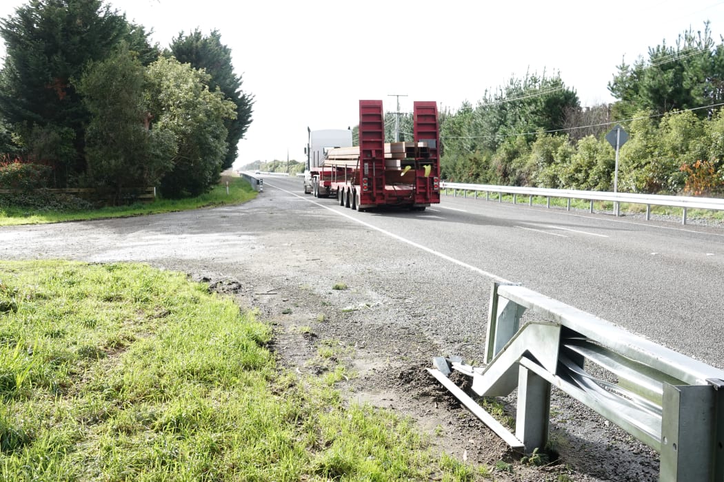 A truck rumbles along SH57 near Levin, with the new barriers on both sides of the road.
