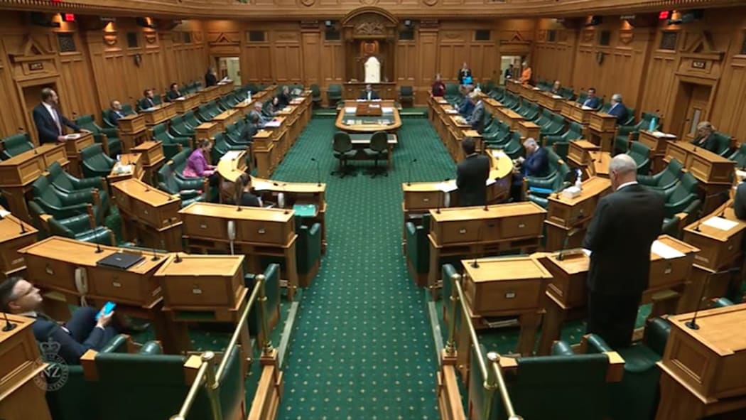 A much smaller number of MPs than the usual 120 are spread out through the debating chamber in an effort to comply with Covid-19 health regulations