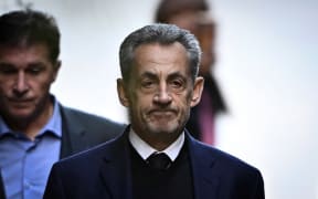 France's former president Nicolas Sarkozy leaves his residence to present himself to La Sante Prison for incarceration on a five-year prison sentence after being convicted of criminal conspiracy over a plan for late Libyan dictator Moamer Kadhafi to fund his 2007 electoral campaign.