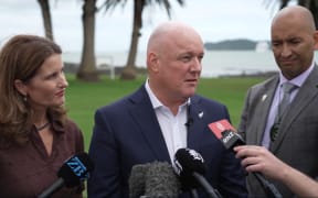PM Christopher Luxon, with Finance Minister Nicola Willis and Māori Crown Relations Minister Tama Potaka at Waitangi.