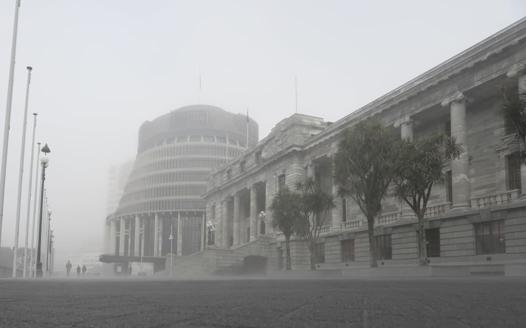 Parliament House and the Beehive wreathed in heavy mist during winter 2019