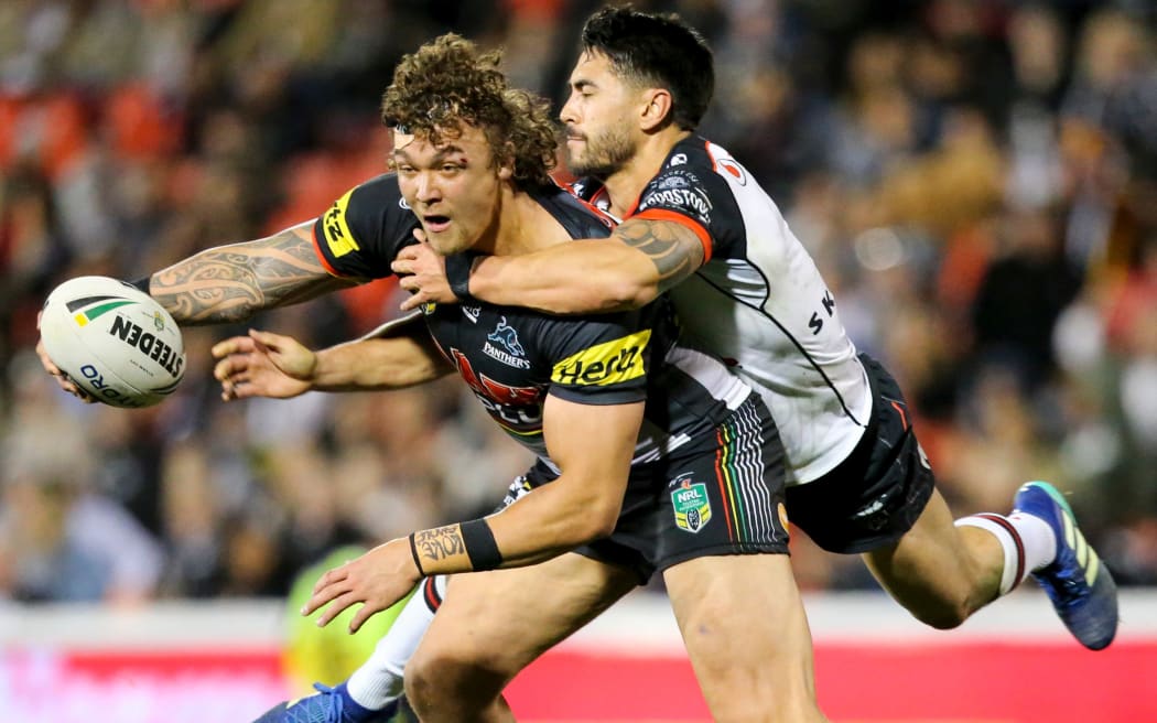 Shaun Johnson tackles James Fisher-Harris. Penrith Panthers v Warriors. NRL Rugby League.