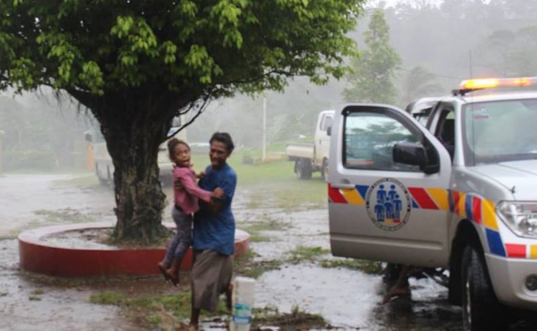 A mother and child seek safety in Vanuatu.