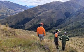 DOC staff working on the rerouted section of the Motatapu Track.
