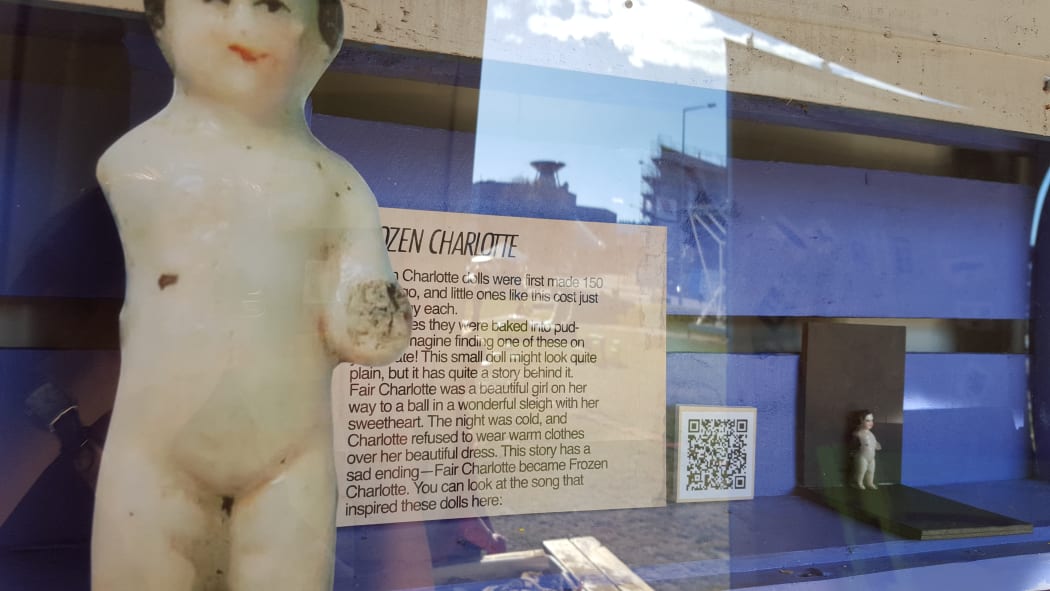 This Frozen Charlotte doll is one of a range of toys on display.