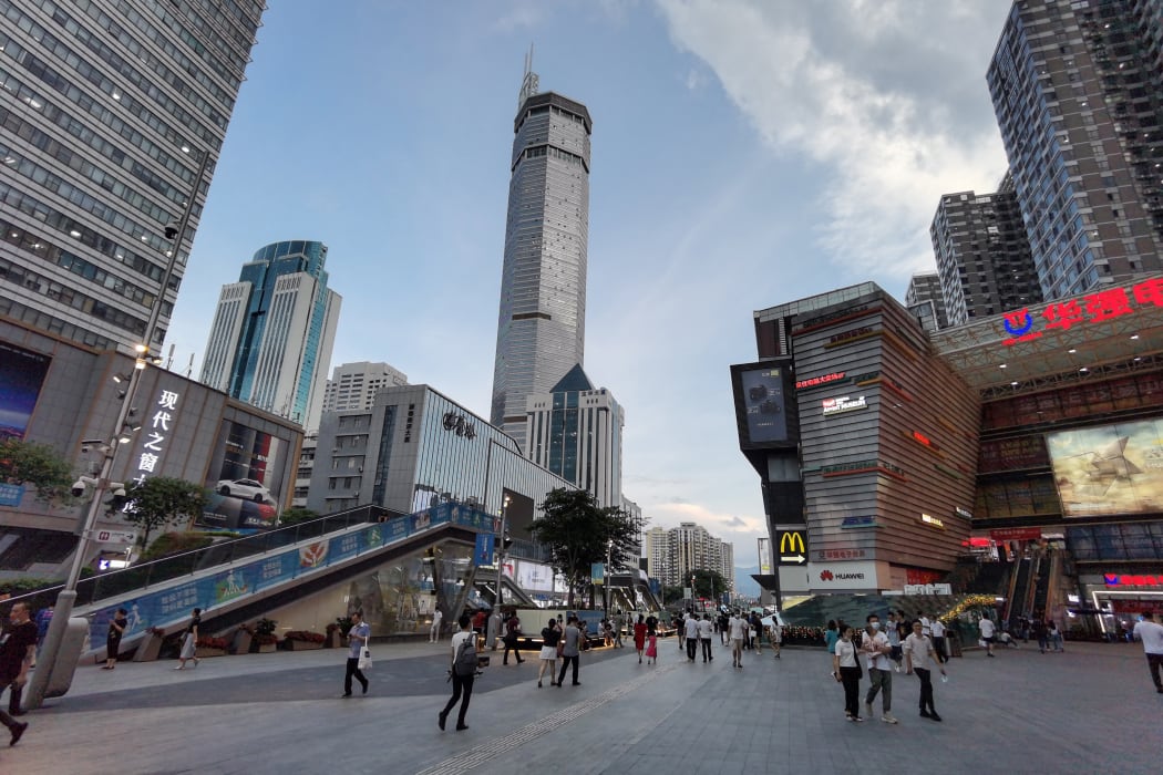 The 300m SEG Plaza building, centre, in Shenzhen, began to shake, sending shoppers fleeing, 18 May 2021.