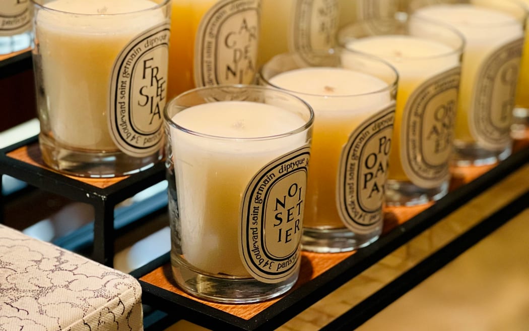 A row of candles at 34 Boulevard, St. Germain candles at Diptyque in Paris, France.