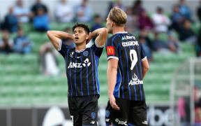 Logan Rogerson (L) of Auckland FC reacts after missing a shot on goal.