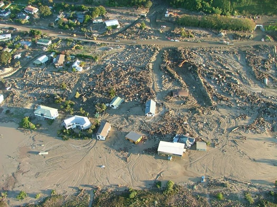 In May 2005, torrential rain washed boulders, logs and debris down a flooded stream, badly damaging properties in Matata .