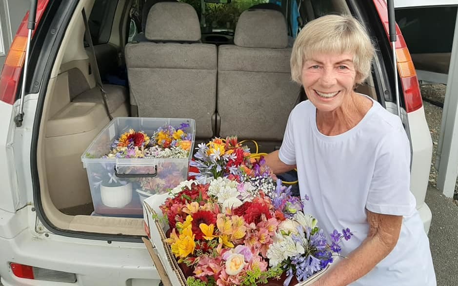 Linda Hart with some of the flowers she delivered to people around Tairua