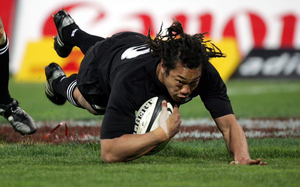 Tana Umaga dives in to score a try during the second test match between the All Blacks and the British and Irish Lions at Westpac Stadium in 2005. 

129087