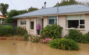 June Gillanders' house in Tai Tapu is surrounded by water from the Halswell River after heavy rain on 1 May in Canterbury.