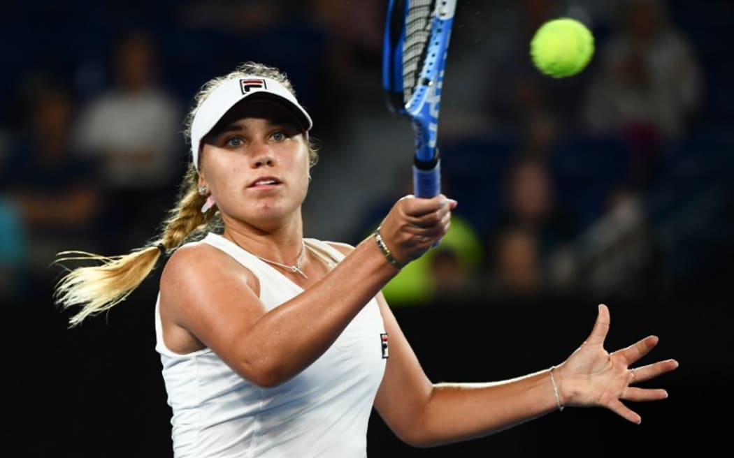Sofia Kenin of the US hits a return against Romania's Simona Halep at the Australian Open tennis tournament in Melbourne on January 17, 2019.