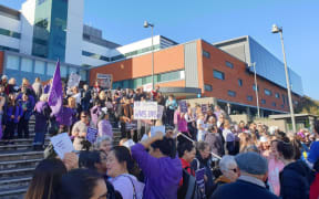 Hundreds of nurses march to Civic Square after gathering outside Wellington Hospital at the beginning of their strike.