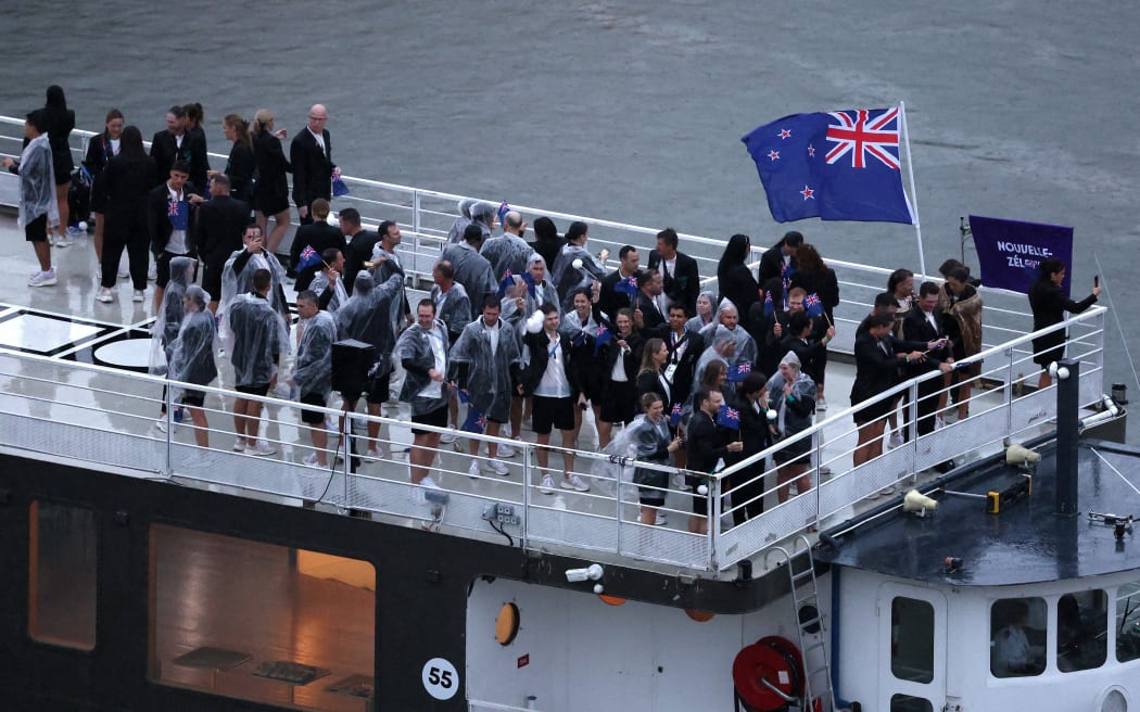 PARIS, FRANCE - JULY 26: Team New Zealand cruise during the athletes parade on the River Seine during the opening ceremony of the Olympic Games Paris 2024 on July 26, 2024 in Paris, France. (Photo by Richard Heathcote / POOL / AFP)