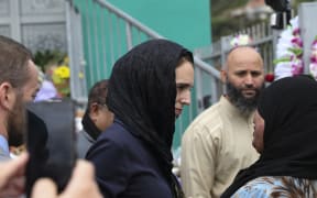 Jacinda Ardern speaks with a muslim woman at the Wellington Islamic Centre mosque in Kilbirnie