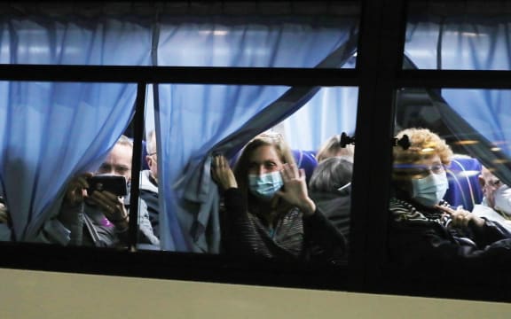 A Japanese defence force bus carries US passengers from Yokoham port to the airport where they will board a charter flight to the United States.