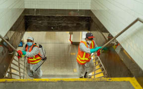 New York Subway MTA officials are seen cleaning and disinfecting during the coronavirus Covid-19 pandemic in the United States on June 8, 2020.