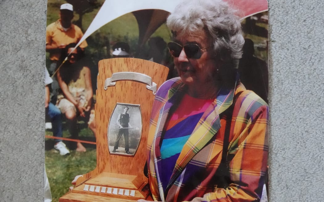 The late Gwen Daly with the Mick Griffin Memorial Trophy, named in honour of her axeman father, in a photo taken around 2011.