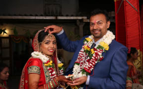 Sandeep Gosai, right, and his wife Divyaben.