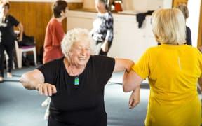 Ruth Busch dancing with her Feisty Feet troupe