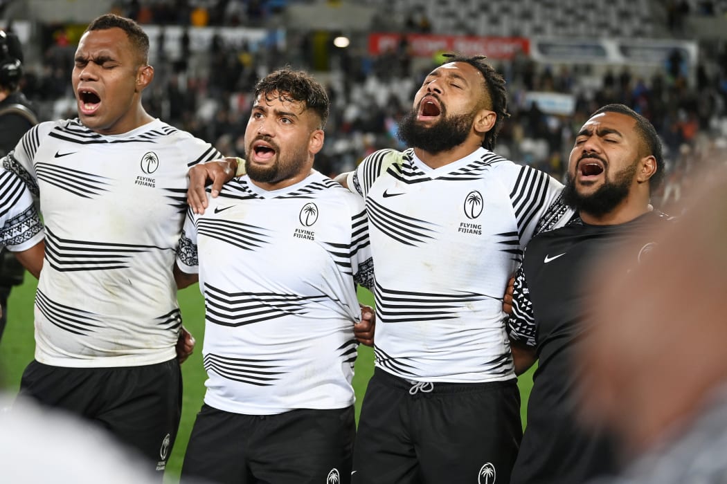 Fiji players sing after playing the All Blacks.
