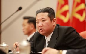 North Korea's official Korean Central News Agency (KCNA) on January 1, 2022 shows North Korean leader Kim Jong Un in Pyongyang. (Photo by KCNA VIA KNS / AFP) / South Korea OUT /