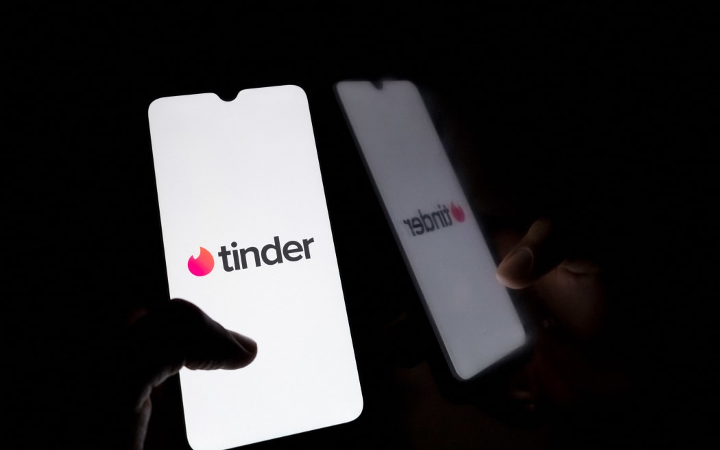 The Tinder logo displays on a smartphone screen in Athens, Greece, on September 12, 2024. (Photo by Nikolas Kokovlis/NurPhoto) (Photo by Nikolas Kokovlis / NurPhoto / NurPhoto via AFP)
