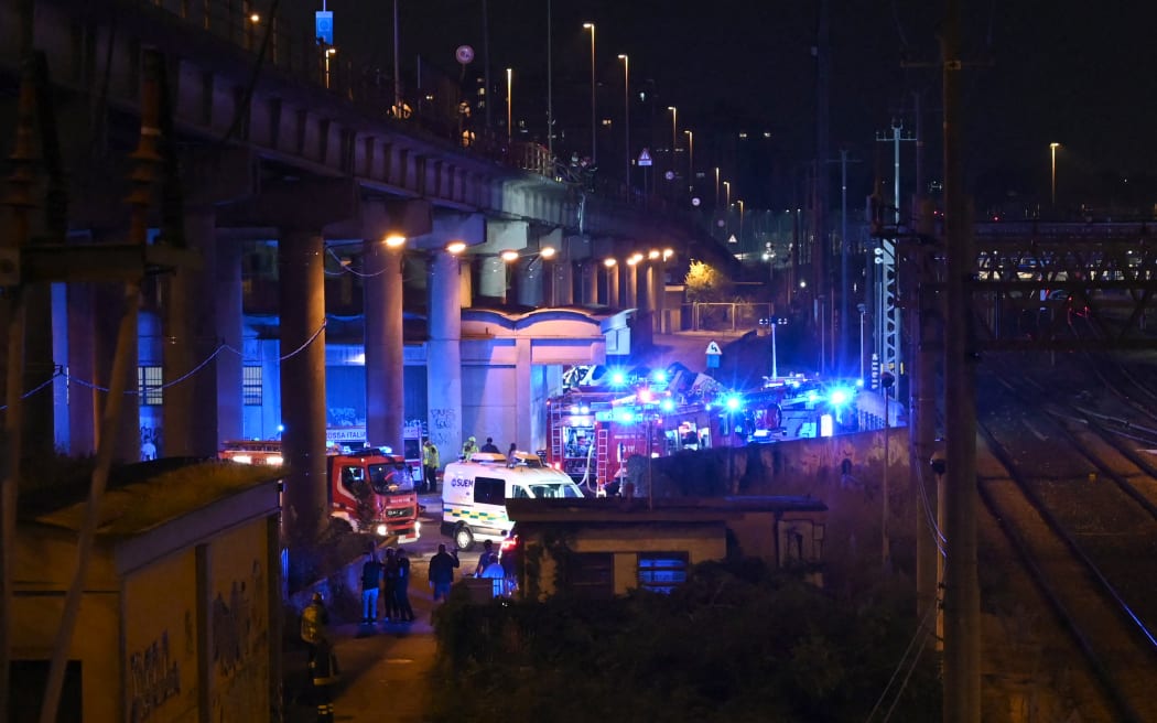 Rescuers work on the site of a bus crash in Mestre, near Venice, Italy.