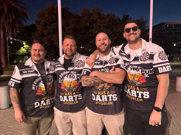 Four men in Darts shirts.