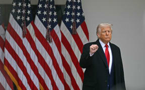 US President Donald Trump pumps his fist as he arrives to delivers remarks on reciprocal tariffs during an event in the Rose Garden entitled "Make America Wealthy Again" at the White House in Washington, DC, on April 2, 2025. Trump geared up to unveil sweeping new "Liberation Day" tariffs in a move that threatens to ignite a devastating global trade war. Key US trading partners including the European Union and Britain said they were preparing their responses to Trump's escalation, as nervous markets fell in Europe and America.