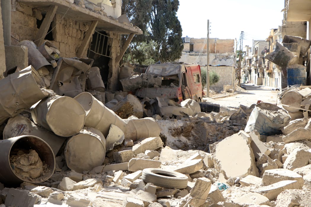 A destroyed ambulance sits among the rubble of a hospital in Aleppo, Syria, that was hit by a barrel bomb during sustained airstrikes on the city.