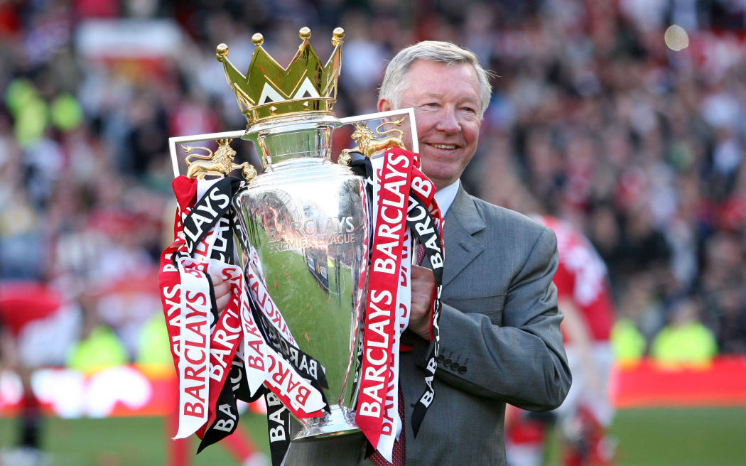 Manchester United manager Sir Alex Ferguson with the 2011 Premier League trophy