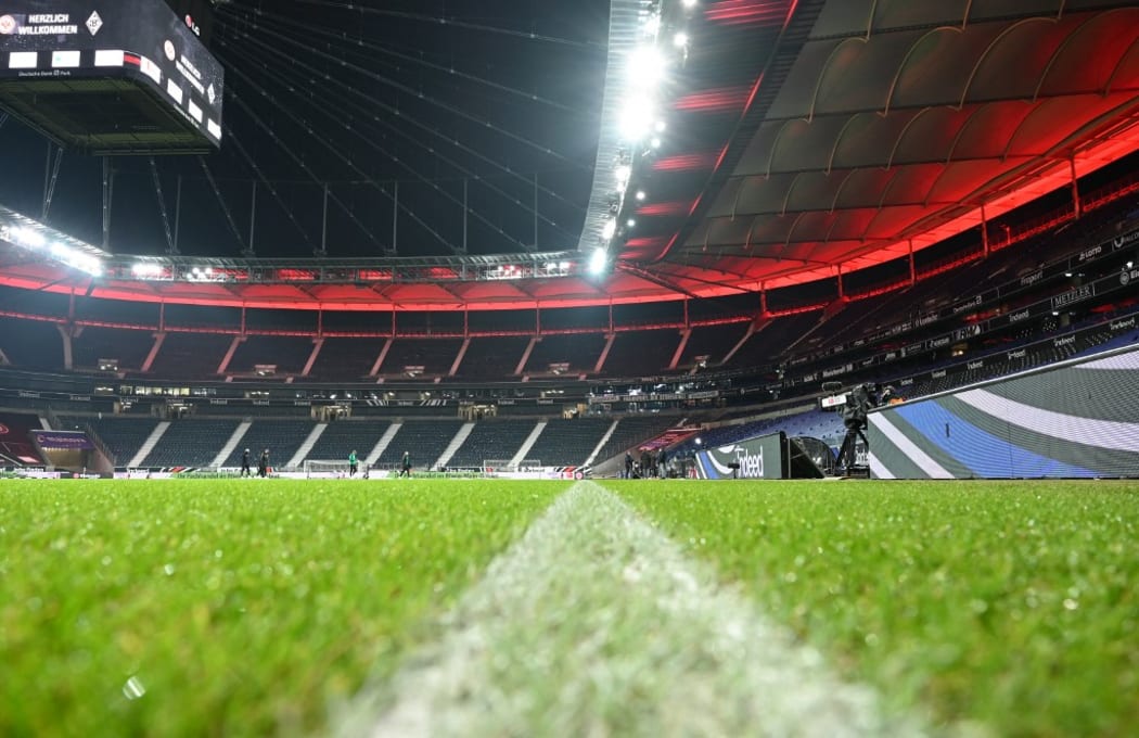 15 December 2020, Hessen, Frankfurt/Main: Football: Bundesliga, Eintracht Frankfurt - Borussia Mönchengladbach, Matchday 12 at Deutsche Bank Park. The white sideline is drawn on the edge of the pitch in the empty stadium.