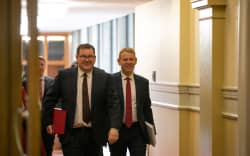 Finance Minister Grant Robertson and Prime Minister Chris Hipkins walk to the Parliament chamber for the delivery of the 2023 Budget, 18 May 2023.