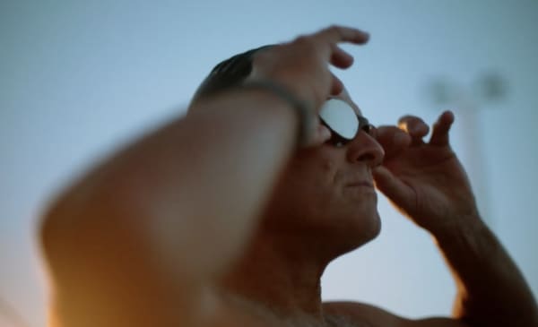 Brendan Cullen adjusts his swim googles and looks into the distance.