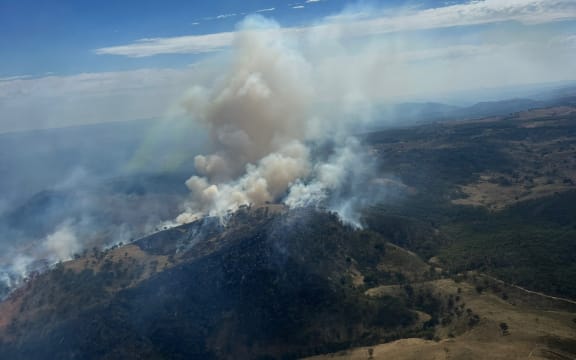 Firefighters are battling to contain a bushfire in Alpha Rd, Tambaroora, in New South Wales, Australia.