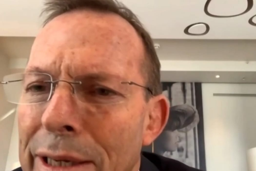 A video grab from footage broadcast by the UK Parliament's Parliamentary Recording Unit (PRU) shows Australian former prime minister Tony Abbott speaking to the Foreign Affairs Committee by remote video feed.