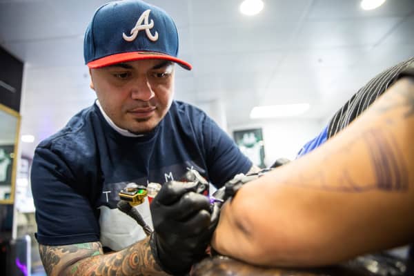 Leroy Roberts of Maia Ink tattooing a client