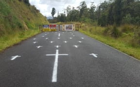 A makeshift checkpoint set up on the road to Pike River Mine by some of the families of the 29 men who died.