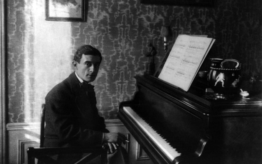 Portrait of Maurice Ravel (1875 - 1937) at the piano.